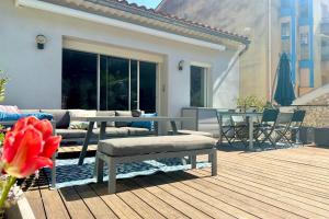 a patio with a table and chairs on a deck at Peaceful apartment in Cavaillon with garage in Cavaillon