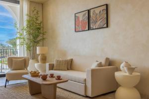 a living room with a couch and a table at Desert Rose Resort in Hurghada