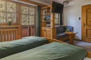 Postel nebo postele na pokoji v ubytování Pension Sonnenwinkl + 14 fotografií