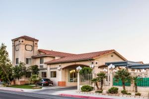 a house with a car parked in front of it at Quality Inn Near China Lake Naval Station in Ridgecrest