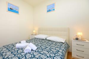 Postel nebo postele na pokoji v ubytování Spacious 4 Bedroom Dubrovnik Apartment
