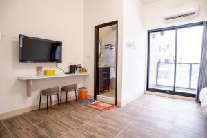 Μια τηλεόραση ή/και κέντρο ψυχαγωγίας στο BAOBAO BnB +12 φωτογραφίες