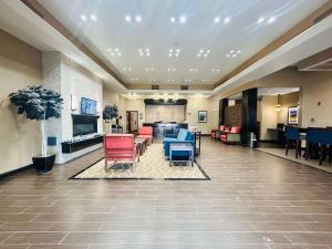 a lobby of a hospital with chairs and a waiting room at Comfort Inn & Suites - Independence in Independence