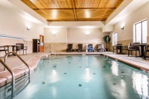 a large swimming pool in a hotel room at Comfort Inn & Suites - Independence in Independence