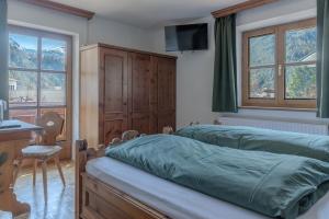 Postel nebo postele na pokoji v ubytování Pension Sonnenwinkl