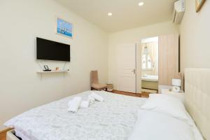 Postel nebo postele na pokoji v ubytování Spacious 4 Bedroom Dubrovnik Apartment