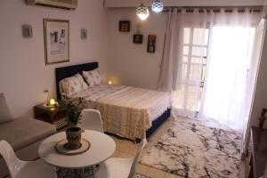 a bedroom with a bed and a table and chairs at Herrmes in Sharm El Sheikh +19 photos