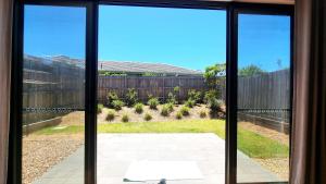 a view of a yard from a window at Cozy Room with Private Bathroom in Wheelers Hill