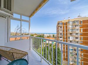 a balcony with a view of a building at Pura Vida King-Size Bed Sea and Mountain view Apartment in Benalmádena