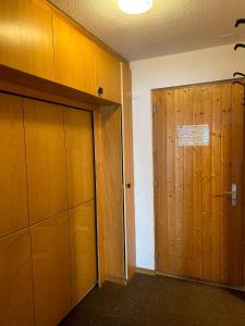 an empty room with a door and a closet at Melezes K 021 - SKI & NATURE apartment 6 pers in Veysonnaz +3 photos