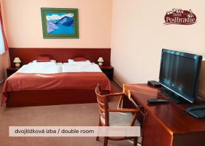 Postel nebo postele na pokoji v ubytování Hotel Podhradie