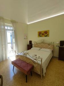 Postel nebo postele na pokoji v ubytování Casa Vacanze Nonna Tetta