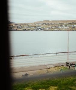 a view of a body of water from a window at Greystone House / Historic / Traditional / Unique in Saltnes