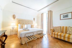 Кровать или кровати в номере Relais Villa San Martino