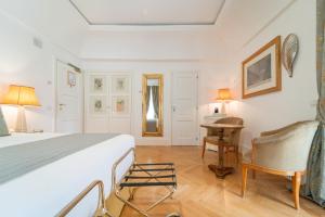 Кровать или кровати в номере Relais Villa San Martino