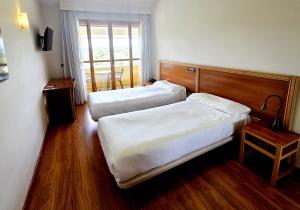 Postel nebo postele na pokoji v ubytování Hotel Los Barruecos by Croma
