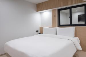 Postel nebo postele na pokoji v ubytování Hotel BELLUS