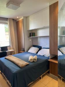a bedroom with a bed with towels on it at Big house 15 minutes to Belém for 6 people in Ananindeua