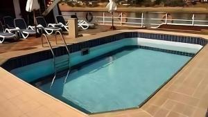 a swimming pool on a cruise ship with chairs at مركب ريفر بوت River Boat in Cairo