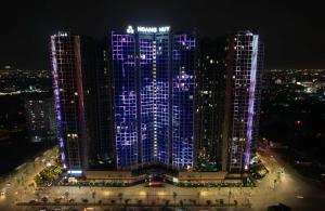 a group of tall buildings lit up at night at 7Homestay in Hai Phong