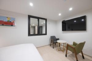 TV a/nebo společenská místnost v ubytování Hotel BELLUS