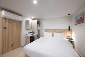 Postel nebo postele na pokoji v ubytování Hotel BELLUS