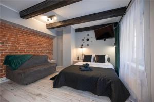 Posteľ alebo postele v izbe v ubytovaní Kościelna Loft Apartaments