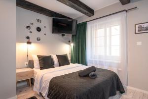 Posteľ alebo postele v izbe v ubytovaní Kościelna Loft Apartaments