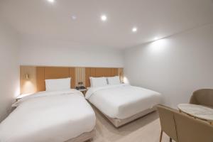 Postel nebo postele na pokoji v ubytování Hotel BELLUS