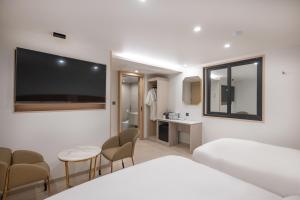 TV a/nebo společenská místnost v ubytování Hotel BELLUS