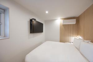 Postel nebo postele na pokoji v ubytování Hotel BELLUS
