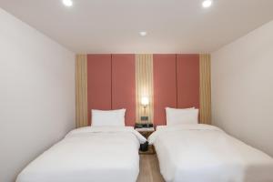 Postel nebo postele na pokoji v ubytování Hotel BELLUS