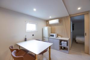 Kuchyň nebo kuchyňský kout v ubytování Hotel BELLUS