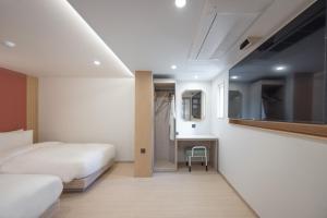 Postel nebo postele na pokoji v ubytování Hotel BELLUS