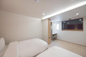 Postel nebo postele na pokoji v ubytování Hotel BELLUS