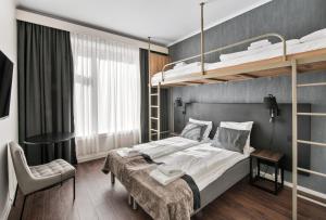 Postel nebo postele na pokoji v ubytování K7 Hotel Oslo