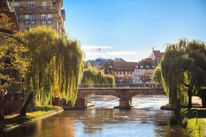 a bridge over a river in a city at Appartement moderne au centre ville in Strasbourg