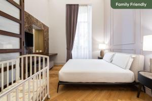 Posteľ alebo postele v izbe v ubytovaní limehome Lecce Palazzo BN