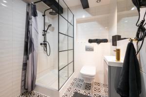 Kúpeľňa v ubytovaní Kościelna Loft Apartaments