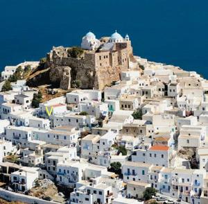 a group of white buildings on top of a mountain at Kastro Astypalea Spitaki in Astypalaia
