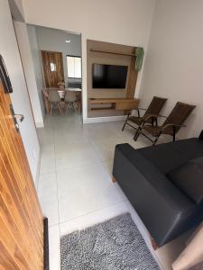 Télévision ou salle de divertissement dans l'établissement Condomínio Bela Vista - Casa 11A