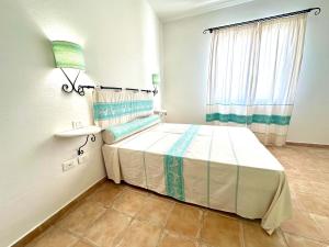Ein Bett oder Betten in einem Zimmer der Unterkunft Futura Style Acqua di Mare Resort