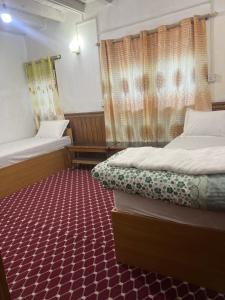 Voodi või voodid majutusasutuse Hotel Dancing Yak toas