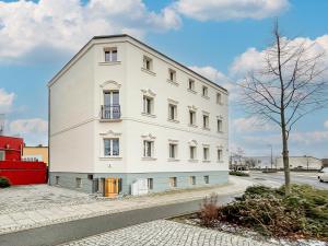 a white building on the side of a street at Westpromenade No 6 in Senftenberg +7 photos