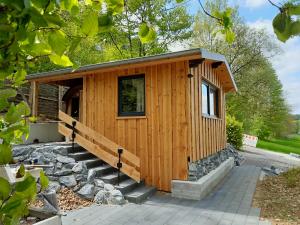 a tiny house on a pile of rocks at Ferienhaus Heideblick in Rüthen