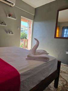 Ένα ή περισσότερα κρεβάτια σε δωμάτιο στο The Seaview Villa