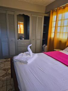Ένα ή περισσότερα κρεβάτια σε δωμάτιο στο The Seaview Villa