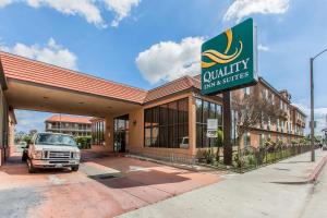 a building with a truck parked in front of it at Quality Inn & Suites Bell Gardens-Los Angeles in Bell Gardens