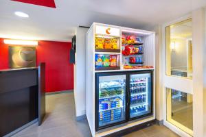 a refrigerator filled with lots of drinks in a store at Comfort Inn East in Moncton
