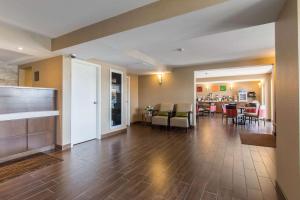 a lobby with a living room and a dining room at Comfort Inn Dartmouth in Halifax